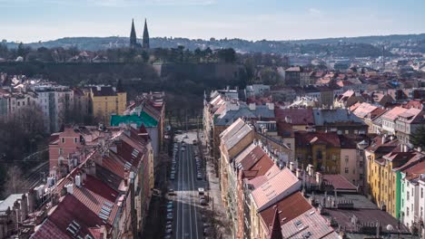 Timelapse-of-Prague-view-from-Nusle-Bridge-with-Vysehrad-Castle-in-the-background,-zoom-in-movement