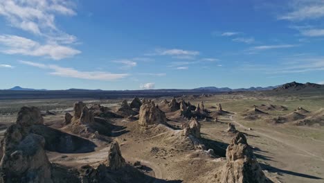 High-aerial-view-moving-slowly-over-the-Trona-Pinnacles-rock-formations-on-a-sunny-morning