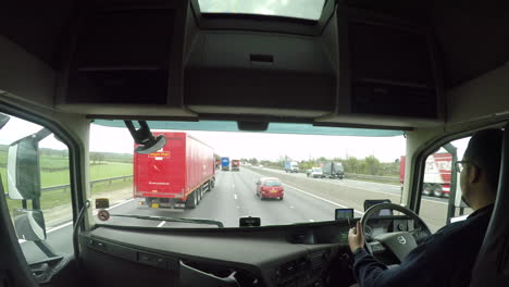 In-cab-view-of-a-HGV-driver-overtaking-other-lorries-on-the-M1-motorway