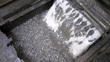 Water-vibrating-to-sift-metal-flakes-in-a-recycling-plant