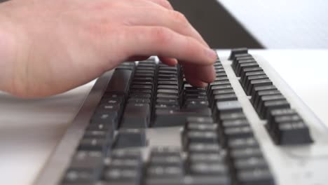 Man-typing-on-computer-keyboard