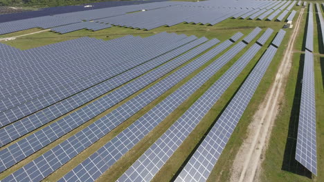 Aerial-fly-over-of-solar-array,-farm-or-power-plant,-sunny,-Portugal