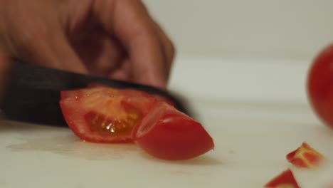 man´s-hand-cutting-tomato-for-dinner