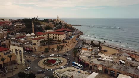 Aerial-clip-of-the-beautiful-old-city-of-Jaffa-in-Israel-taken-near-the-Jaffa-Clock-Tower-starting-from-the-traffic-rotunda-going-to-the-coastal-promenade-circa-March-2019