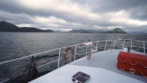SLOWMO---Panorama-view-from-front-deck-of-cruise-boat-on-cloudy-day-in-New-Zealand