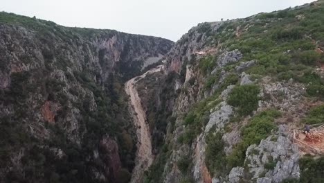 Flying-over-Gjipe-Canyon-in-Albania-looking-out-into-the-sea-during-sunset