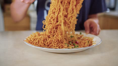 Mixing-a-plate-of-dry-instant-noodles