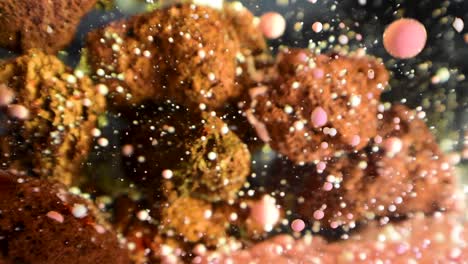 slow-moving-debris-falling-over-porous-rocky-alien-structure-with-dreamy-underwater-effect-60fps