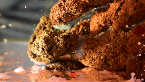 color-oil-drops-falling-over-porous-rocky-alien-structure-with-dreamy-underwater-effect-60fps