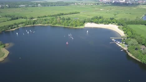 Aerial-footage-of-the-lake-with-few-sailboats-in-Europe-Holland-in-4K