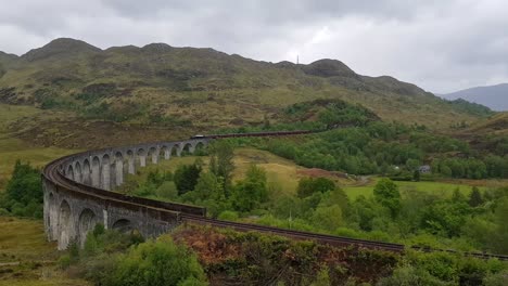 Steam-train-on-famous-Glenfinnan-viaduct-driving-towards-camera
