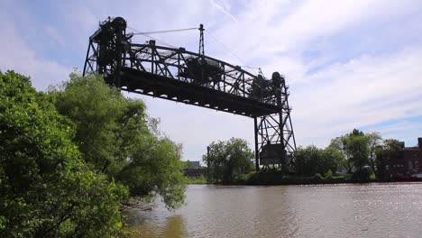 Cuyahoga-River-bridge-spanning-over-the-water-on-a-blue-sky-day