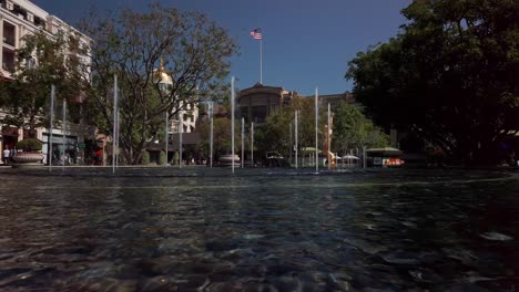 Static,-shot-of-water-fountain,-statue,-American-Flag,-at-Americana-Mall,-in-Glendale,-California,-USA