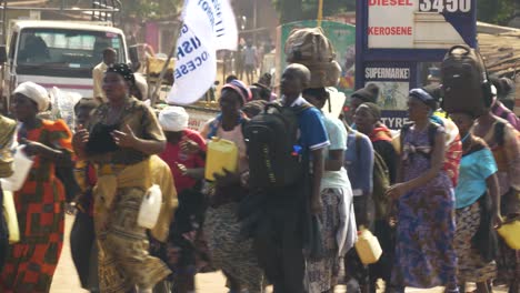 A-group-of-Ugandan-catholics-walking-on-a-busy-highway-while-carrying-banners-while-on-a-spiritual-pilgrimage