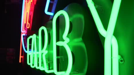 Close-shot-of-a-green-neon-sign-in-polish