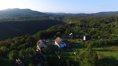 Panoramic-aerial-drone-shot-of-cabins-in-the-Plitvice-National-Park-Central-Croatia