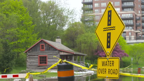 Water-Over-Road-sign-posted-after-spring-flooding