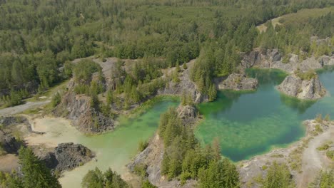 Beautiful-Aerial-View-of-the-Colorful-Lakes-in-the-Canadian-Nature-during-a-sunny-summer-day