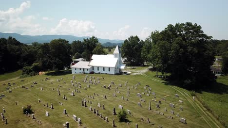 Aerial-push-into-church-chapel-with-mountain-backdrop-near-Abington-Virginia