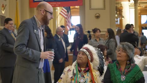 Native-American-royalty-speaking-to-a-government-official-at-the-Ute-flag-tribute-at-the-Denver-Capitol-building