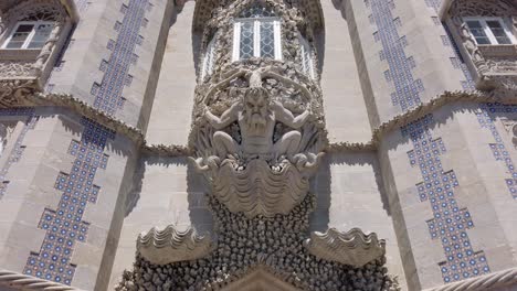 Arch-of-the-Triton-overlooks-archway-of-Pena-Palace-in-Sintra,-Portugal