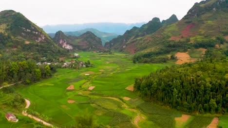 Lush-green-rice-fields-surround-tiny-villages-in-the-misty-mountains-of-Northern-Vietnam