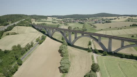 Drone-shot-of-a-beautiful-arch-viaduct-near-a-german-Motorway-the-Autobahn,-Germany,-Europe