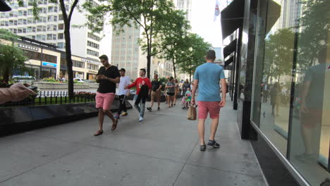 Chicago,-Michigan-Avenue,-Street-view,-sidewalk,-people-passing,-walking,-tilt-camera-movement,-United-States,-Usa