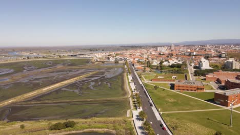 4K-aerial-view-of-Aveiro-city-on-the-left-side-of-the-street-and-the-saline’s-in-the-right-side,-6ofps
