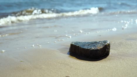 Alone-stone-on-sand-beach-on-polish-Baltic-Sea