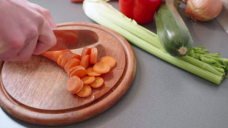 Slow-motion-of-cutting-a-carrot-into-small-wheels