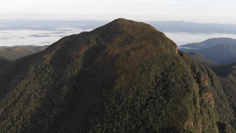 Aerial-view-circling-the-summit-of-a-rainforest-tropical-mountain,-Pico-Caratuva,-Brazil,-South-America
