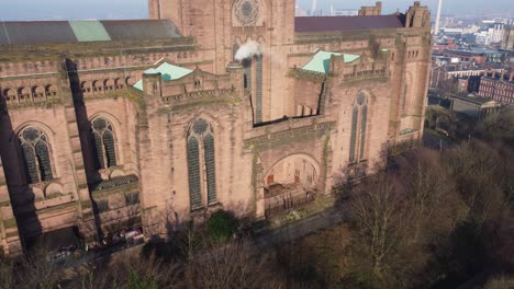 Liverpool-Anglican-cathedral-historical-gothic-landmark-aerial-pan-left-across-historic-building