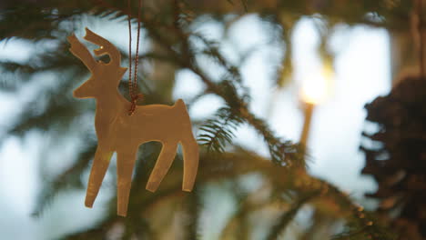 CHRISTMAS-DECORATIONS---Wool-reindeer-on-a-Christmas-tree,-Sweden,-close-up
