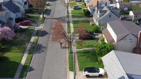 An-aerial-shot-over-a-suburban-neighborhood-on-a-sunny-day