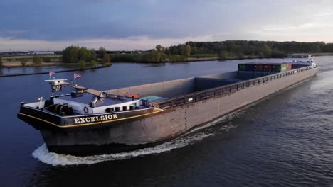 Excelsior-Barge-With-Empty-Cargo-Holds-Traveling-Across-Waterways-Of-Barendrecht,-Netherlands,-Near-Rotterdam,-South-Holland