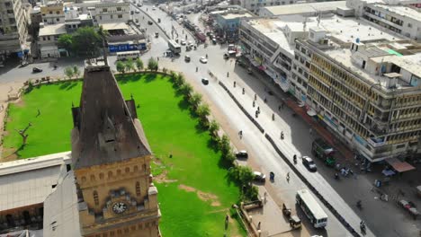 Aerial-View-Over-Empress-Market-Clock-Tower-And-Green-Gardens-In-Saddar-Town