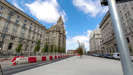 Liverpool-royal-liver-building-urban-city-street-time-lapse-traffic-moving-at-fast-pace-city-life-commuter-vehicles