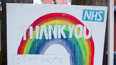 Thank-you-NHS-key-workers-close-up-of-sign-on-street-with-rainbow-in-Covid-pandemic