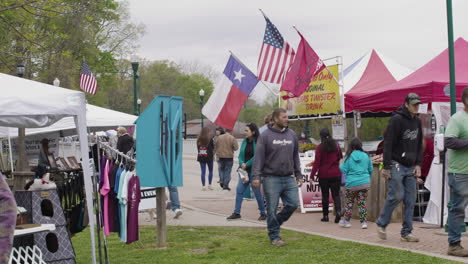 People-walk-among-the-booths-during-Dogwood-Festival,-Siloam-Springs,-Arkansas