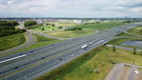 Aerial-of-traffic-on-motorway-A6-in-the-Netherlands,-shot-on-a-quiet-summer-day