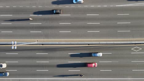 Aerial-overhead-view-of-traffic-on-highway-on-sunny-day-in-Argentina