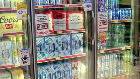 Pan-of-a-full-beer-cooler-at-a-local-convenience-store