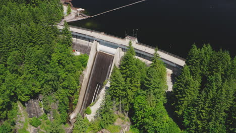 Aerial-view-of-water-flowing-down-a-spillway-on-a-hydroelectric-dam