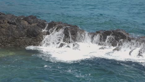 Waves-breaking-on-sea-rocks-at-Porto-do-Frades,-Portugal