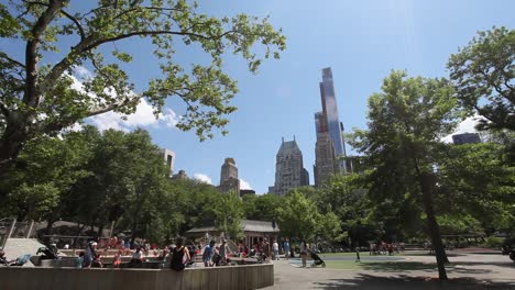 Families-at-cityscape-playground-in-Central-Park-in-Manhattan,-New-York-City