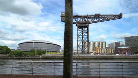 Wide-Dolly-Left-To-Right-of-The-SSE-Hydro-and-Finnieston-Crane-From-The-Clyde-Walkway,-Glasgow