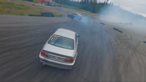 Two-BMW-cars-synchronised-drifting-in-Borås