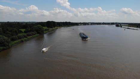 Aerial-Of-Aubrig-Tanker-Ans-Small-White-Boat-Travelling-Along-Oude-Maas
