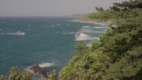 Storm-reaching-Sea-of-Japan-coastline-in-Tottori-Prefecture,-Japan